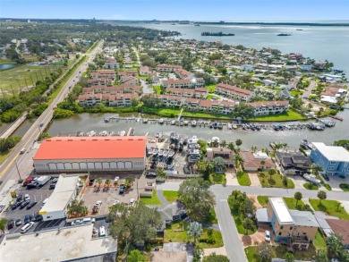 Prime location in the heart of Dunedin! 3-bedroom, 2-bath home on The Dunedin Country Club in Florida - for sale on GolfHomes.com, golf home, golf lot