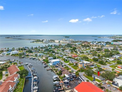 Prime location in the heart of Dunedin! 3-bedroom, 2-bath home on The Dunedin Country Club in Florida - for sale on GolfHomes.com, golf home, golf lot