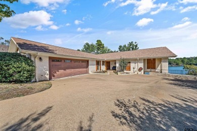 This beautiful lakefront property in Hideaway offers everything on Hide-A-Way Lake Golf Course in Texas - for sale on GolfHomes.com, golf home, golf lot