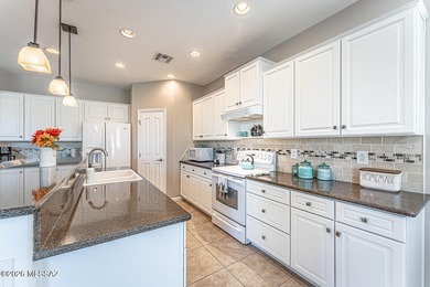 Embrace this serene oasis at 2445 E Sky Creek Drive, where every on Quail Creek Country Club  in Arizona - for sale on GolfHomes.com, golf home, golf lot