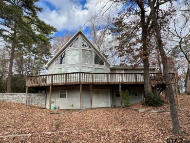 Experience the enchanting rhythm of nature year-round in this on Holly Lake Ranch Golf Club in Texas - for sale on GolfHomes.com, golf home, golf lot