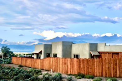 This is a remarkable custom home built in 2025 by renowned local on Taos Country Club in New Mexico - for sale on GolfHomes.com, golf home, golf lot