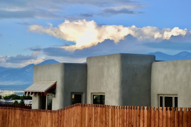 This is a remarkable custom home built in 2025 by renowned local on Taos Country Club in New Mexico - for sale on GolfHomes.com, golf home, golf lot