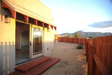 This is a remarkable custom home built in 2025 by renowned local on Taos Country Club in New Mexico - for sale on GolfHomes.com, golf home, golf lot