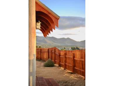 This is a remarkable custom home built in 2025 by renowned local on Taos Country Club in New Mexico - for sale on GolfHomes.com, golf home, golf lot
