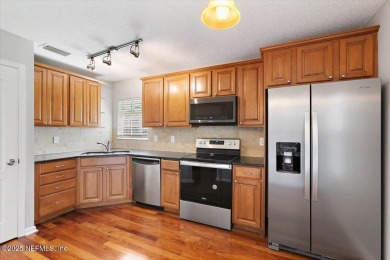 Unique town home in gated Magnolia Point Golf & Country Club! on Magnolia Point Golf and Country Club in Florida - for sale on GolfHomes.com, golf home, golf lot