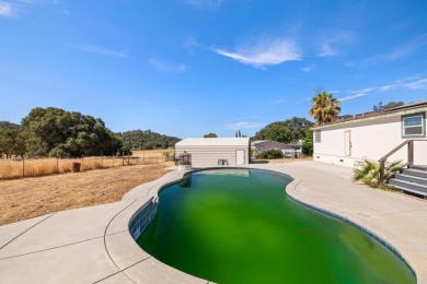 Spacious, clean, and move-in ready, this 4 bedroom, 2 bathroom on La Contenta Golf Course in California - for sale on GolfHomes.com, golf home, golf lot