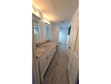 WELCOME TO PARADISE! You will LOVE this Elegant upgraded on East Lake Woodlands Country Club in Florida - for sale on GolfHomes.com, golf home, golf lot