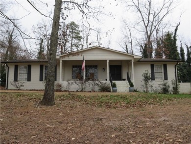 This sprawling brick ranch is in the perfect location! Minutes on Cherokee Golf and Country Club in Georgia - for sale on GolfHomes.com, golf home, golf lot