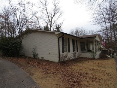 This sprawling brick ranch is in the perfect location! Minutes on Cherokee Golf and Country Club in Georgia - for sale on GolfHomes.com, golf home, golf lot