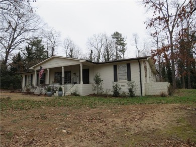 This sprawling brick ranch is in the perfect location! Minutes on Cherokee Golf and Country Club in Georgia - for sale on GolfHomes.com, golf home, golf lot