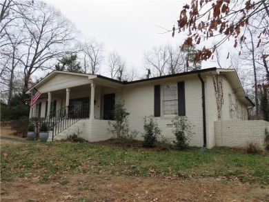 This sprawling brick ranch is in the perfect location! Minutes on Cherokee Golf and Country Club in Georgia - for sale on GolfHomes.com, golf home, golf lot