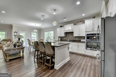 Nestled in a serene cul-de-sac, this meticulously maintained on Reunion Golf Club in Georgia - for sale on GolfHomes.com, golf home, golf lot