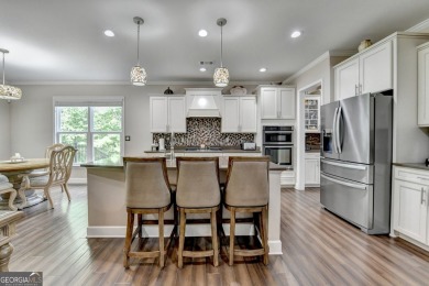 Nestled in a serene cul-de-sac, this meticulously maintained on Reunion Golf Club in Georgia - for sale on GolfHomes.com, golf home, golf lot