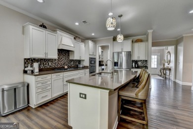 Nestled in a serene cul-de-sac, this meticulously maintained on Reunion Golf Club in Georgia - for sale on GolfHomes.com, golf home, golf lot