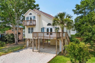 Welcome to 154 Cedar Point Avenue, a classic raised beach home on Wachesaw Plantation Club in South Carolina - for sale on GolfHomes.com, golf home, golf lot
