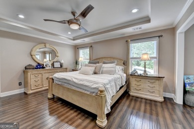 Nestled in a serene cul-de-sac, this meticulously maintained on Reunion Golf Club in Georgia - for sale on GolfHomes.com, golf home, golf lot