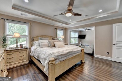 Nestled in a serene cul-de-sac, this meticulously maintained on Reunion Golf Club in Georgia - for sale on GolfHomes.com, golf home, golf lot