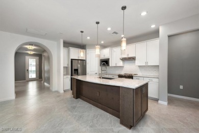 This upgraded 2023 Pulte Summerwood floor plan features an on River Hall Country Club in Florida - for sale on GolfHomes.com, golf home, golf lot