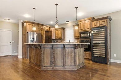 Nestled in the highly desirable Creekmoor community in Raymore on Golf Club of Creekmoor in Missouri - for sale on GolfHomes.com, golf home, golf lot