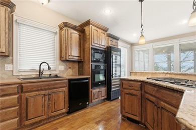 Nestled in the highly desirable Creekmoor community in Raymore on Golf Club of Creekmoor in Missouri - for sale on GolfHomes.com, golf home, golf lot