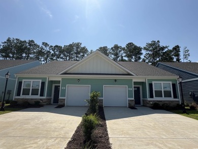 This home features 2 bedrooms and a flex room with french doors on Brunswick Plantation and Golf Resorts in North Carolina - for sale on GolfHomes.com, golf home, golf lot
