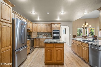 Tucked away on a quiet and prestigious cul-de-sac in the rolling on LakeRidge Golf Course in Nevada - for sale on GolfHomes.com, golf home, golf lot