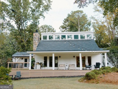 Step inside this one-of-a-kind mid-century home overlooking on Newnan Country Club in Georgia - for sale on GolfHomes.com, golf home, golf lot