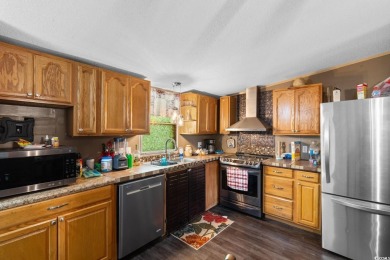 Welcome to 1038 Palm Drive, a delightful 3-bedroom, 2-bathroom on Wild Wing Plantation in South Carolina - for sale on GolfHomes.com, golf home, golf lot