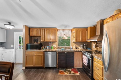 Welcome to 1038 Palm Drive, a delightful 3-bedroom, 2-bathroom on Wild Wing Plantation in South Carolina - for sale on GolfHomes.com, golf home, golf lot