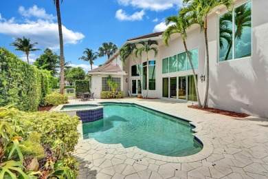 Golf course vistas fill this elegant custom 2-story 6 BD/5 BA on Woodfield Country Club in Florida - for sale on GolfHomes.com, golf home, golf lot