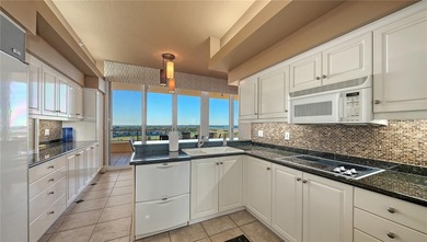 Fully furnished Gulf-to-bay residence perched on the 9th floor on Links on Longboat Golf Club in Florida - for sale on GolfHomes.com, golf home, golf lot