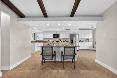 Waterfront living with Gulf access in the heart of Gulf Harbors on Gulf Harbors Golf Course in Florida - for sale on GolfHomes.com, golf home, golf lot