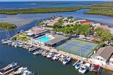 Waterfront living with Gulf access in the heart of Gulf Harbors on Gulf Harbors Golf Course in Florida - for sale on GolfHomes.com, golf home, golf lot