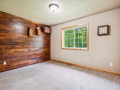 Nestled on a tranquil dead-end road, this stunning four-bedroom on Deacons Lodge Golf Course in Minnesota - for sale on GolfHomes.com, golf home, golf lot