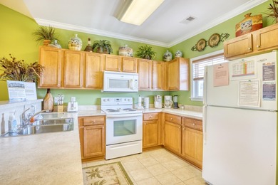 This two-bedroom, two-bath condo is located in the admired on Barefoot Resort and Golf Club  in South Carolina - for sale on GolfHomes.com, golf home, golf lot