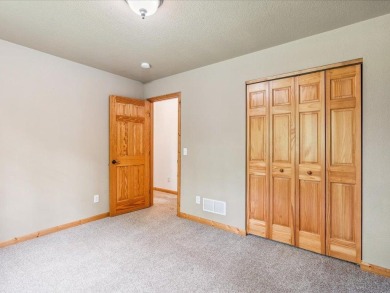 Nestled on a tranquil dead-end road, this stunning four-bedroom on Deacons Lodge Golf Course in Minnesota - for sale on GolfHomes.com, golf home, golf lot
