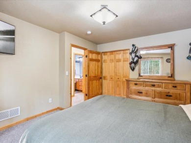 Nestled on a tranquil dead-end road, this stunning four-bedroom on Deacons Lodge Golf Course in Minnesota - for sale on GolfHomes.com, golf home, golf lot