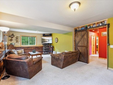 Nestled on a tranquil dead-end road, this stunning four-bedroom on Deacons Lodge Golf Course in Minnesota - for sale on GolfHomes.com, golf home, golf lot