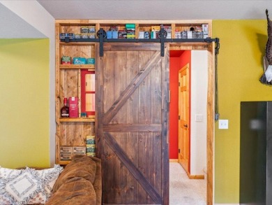 Nestled on a tranquil dead-end road, this stunning four-bedroom on Deacons Lodge Golf Course in Minnesota - for sale on GolfHomes.com, golf home, golf lot