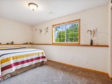 Nestled on a tranquil dead-end road, this stunning four-bedroom on Deacons Lodge Golf Course in Minnesota - for sale on GolfHomes.com, golf home, golf lot