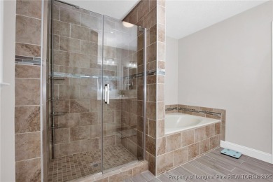 Welcome to this beautifully maintained gem in the highly sought on Gates Four Golf and Country Club in North Carolina - for sale on GolfHomes.com, golf home, golf lot
