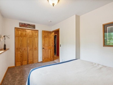 Nestled on a tranquil dead-end road, this stunning four-bedroom on Deacons Lodge Golf Course in Minnesota - for sale on GolfHomes.com, golf home, golf lot