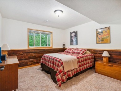 Nestled on a tranquil dead-end road, this stunning four-bedroom on Deacons Lodge Golf Course in Minnesota - for sale on GolfHomes.com, golf home, golf lot