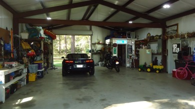 A beautiful water-view home on Toledo Bend Lake.  THIS ONE on Cypress Bend Golf Course in Texas - for sale on GolfHomes.com, golf home, golf lot