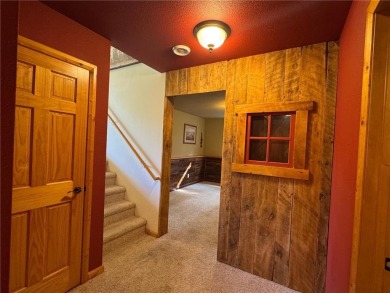 Nestled on a tranquil dead-end road, this stunning four-bedroom on Deacons Lodge Golf Course in Minnesota - for sale on GolfHomes.com, golf home, golf lot