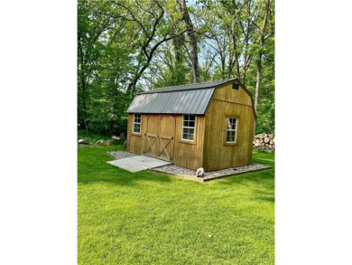 Nestled on a tranquil dead-end road, this stunning four-bedroom on Deacons Lodge Golf Course in Minnesota - for sale on GolfHomes.com, golf home, golf lot
