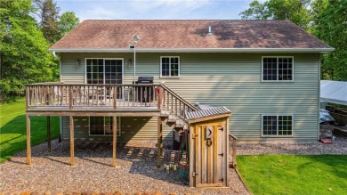 Nestled on a tranquil dead-end road, this stunning four-bedroom on Deacons Lodge Golf Course in Minnesota - for sale on GolfHomes.com, golf home, golf lot