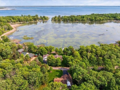 Nestled on a tranquil dead-end road, this stunning four-bedroom on Deacons Lodge Golf Course in Minnesota - for sale on GolfHomes.com, golf home, golf lot