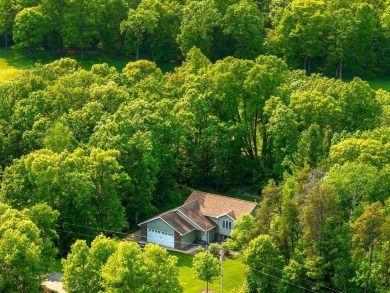 Nestled on a tranquil dead-end road, this stunning four-bedroom on Deacons Lodge Golf Course in Minnesota - for sale on GolfHomes.com, golf home, golf lot